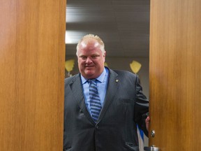 Mayor Rob Ford closes the door after receiving guests from the U.S. in his office on Thursday, July 17, 2014. (ERNEST DOROSZUK/Toronto Sun)