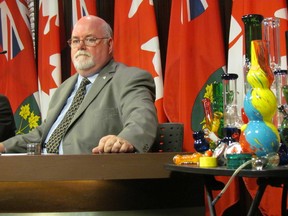 Marc Paris, executive director for Partnership for a Drug-Free Canada, in front of illegal drug-related items found for sale in some convenience stores. He joined with Ontario Safety League at a media conference at Queen's Park on Thursday, July 17 2014, in calling for the provincial government to ban lottery ticket sales out of corner stores that sell this drug paraphernalia. (ANTONELLA ARTUSO/Toronto Sun)