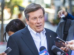 Mayoral candidate John Tory announces his plans to deal with gridlock during a presser on Adelaide St. W. on Thursday, July 17, 2014. (ERNEST DOROSZUK/Toronto Sun)