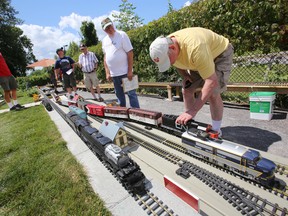 There is plenty of action and model trains to operate around the Belleville and Eastern Ontario Railway or Barry Birkett's backyard in Belleville, Ont.'s west end Thursday, July 17, 2014. - Jerome Lessard/The Intelligencer/QMI Agency