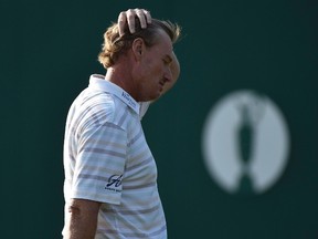 Ernie Els of South Africa walks off the 18th green after finishing his first round of the British Open at the Royal Liverpool Golf Club in Hoylake, England on Thursday, July 17, 2014. (Toby Melville/Reuters)