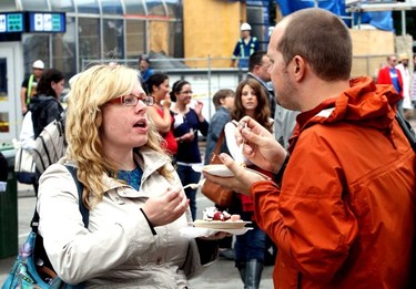 People try some dishes during the opening day for Taste of Edmonton at Churchill Square in Edmonton, Alberta on July 17, 2014.  Perry Mah/Edmonton Sun/QMI Agency