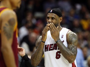 Miami Heat's LeBron James blows kisses to a fan during the first half of the Heat's NBA basketball game against the Cleveland Cavaliers in Cleveland, Ohio, December 2, 2010. (REUTERS/Aaron Josefczyk)