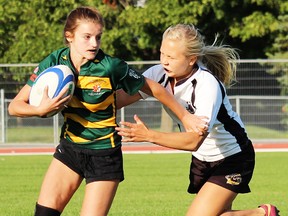 Emmi Merilainen of the Belleville U16 girls Junior Bulldogs runs down a Cobourg Saxons ballcarrier during midweek rugby action at MAS Park. (PHOTO SUBMITTED)