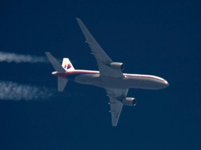 Malaysia Airlines Boeing 777 flight MH-17 with the registration number 9M-MRD flies over Poland from Amsterdam to Kuala Lumpur in this April 12, 2012 photo.

REUTERS/Tomasz Bartkowiak