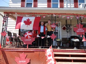 Local MP Guy Lauzon and executive assistant Eric Duncan visit the very patriotic home of Manon Leger in Cornwall in this 2012 photo.