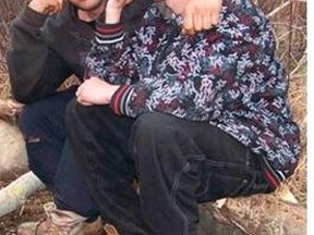(From left) Kristopher Lavallee and Gregory Hepp pose for a photo at the campsite they were living at in Minnow Lake in the spring of 2009. The photo was taken on April 25, two days before 15-year-old Whitney Van Der Wouden was murdered, dismembered and burned at the campsite. The photo was taken by Wilfred Goulet, the father of an acquaintance of Lavallee. About a month later, Goulet led police to the campsite where Van Der Wouden’s remains were discovered. 
PHOTO SUPPLIED/THE SUDBURY STAR