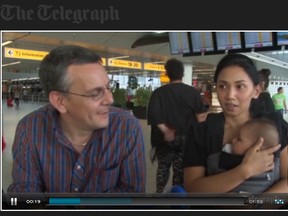 Barry and Izzy Sim are pictured with their child in this screengrab from the Telegraph’s video.