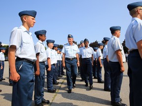 Reviewing officer Hon. Col. Mike Potter, centre, inspects the parade during a first graduation ceremony held at 8 Wing/CFB Trenton, Ont. this summer where 360 air cadets from the Trenton Cadets Training Centre earned the fruits of their efforts Friday morning, July 18, 2014. - Jerome Lessard/The Intelligencer/QMI Agency