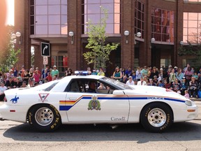 The Edmonton Police Service street legal car makes its way through the 2014 K-Days parade in downtown Edmonton. K-Days runs from July 18 to 27, 2014. Ian Kucerak/Edmonton Sun/QMI Agency