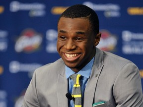 Andrew Wiggins walks off the stage after being selected as the No. 1 overall pick by the Cleveland Cavaliers in the 2014 NBA Draft. (Brad Penner-USA TODAY Sports)