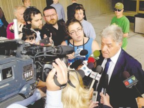 Former London mayor Joe Fontana talks to the media outside the London courthouse after being given a sentence of four months? house arrest and 18 months? probation in his fraud conviction in on Tuesday. (Mike Hensen/The London Free Press)