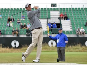 Canada's David Hearn watches his shot from the 4th tee during a practice round at Royal Liverpool Golf Course in Hoylake, north west England on July 16, 2014 ahead of The British Open Golf Championship. (AFP PHOTO/PAUL ELLIS)