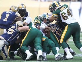 Pat White ran for a first down on a direct-snap play during Thursday's game at Investor's Group Field in Winnipeg. (Kevin King, QMI Agency)