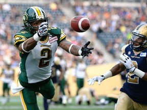 Fred Stamps reaches for a pass during Thursday's game against the Winnipeg Blue Bombers at Investors Group Field. (Reuters)