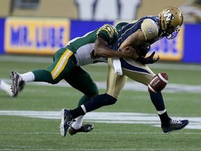 dmonton Eskimos' Otha Foster (37) tackles Winnipeg Blue Bombers' Nick Moore (17) causing a fumble during second half CFL Football at Investors Group Field.