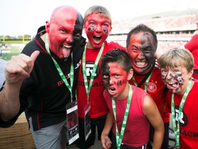 Fans take in the first home game of the Ottawa Redblacks CFL season at the newly build TD Place in Ottawa, July 18, 2014. (Chris Roussakis/Ottawa Sun/QMI Agency)