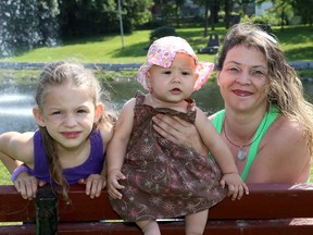 Chelsea Lech with her daughters Tigan, 6, and Tamia, eight months. (Ian MacAlpine/The Whig-Standard)