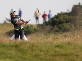 Northern Ireland's Rory McIlroy plays from the rough during his second round 66, on day two of The Open Golf Championship at Royal Liverpool Golf Course in Hoylake, north west England. AFP PHOTO / PETER MUHLY