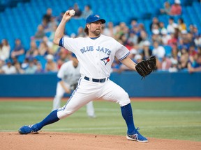 Toronto Blue Jays starting pitcher R.A. Dickey (43) throws a pitch during the first inning in a game against the Texas Rangers at Rogers Centre on Jul 18, 2014 in Toronto, Ontario, CAN. (Nick Turchiaro/USA TODAY Sports)