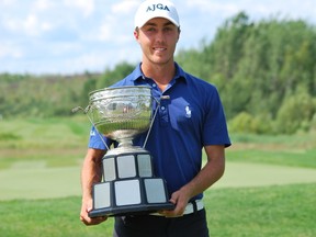 Keith Dempsey/For The Sudbury Star
Matt LeMay of Whistle Bear Golf Club celebrates his Ontario Junior Boys' Championship tournament win at Timberwolf Golf Course on Friday.