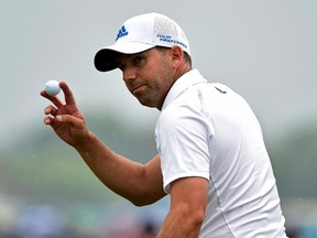 Sergio Garcia of Spain gestures after making a birdie putt on the fifth green during the third round of the British Open Championship at the Royal Liverpool Golf Club in Hoylake, northern England, on July 19, 2014.  (REUTERS)