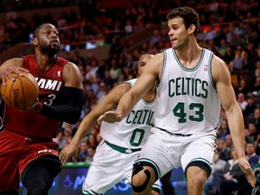 Miami Heat guard Dwyane Wade (3) shoots the ball as Boston Celtics forward/centre Kris Humphries (43) defends during the first quarter at TD Garden. (Greg M. Cooper-USA TODAY Sports)