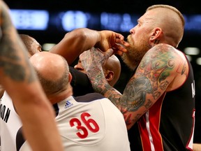 Chris Andersen #11 of the Miami Heat tries to break up a scuffle between Ray Allen of the Miami Heat and Alan Anderson #6 of the Brooklyn Nets in Game Three of the Eastern Conference Semifinals during the 2014 NBA Playoffs at the Barclays Center on May 10, 2014 in the Brooklyn borough of New York City. (Elsa/Getty Images/AFP)