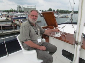 Scott Young, of Chatham, sits at the wheel of his boat at Saturday's Antique and Classic Boat Show held at Sarnia Bay Marina. Approximately 20 boats were on display during the free event. PAUL MORDEN/THE OBSERVER/QMI AGENCY