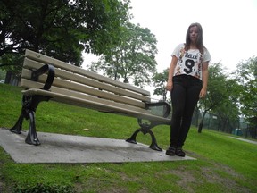 Alyson Kearnan-Leitch, 16, stands at the Gibbons Park bench from which a memorial plaque was stolen. (DALE CARRUTHERS, The London Free Press)