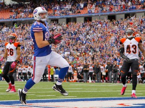 Buffalo Bills tight end Scott Chandler (84) runs the ball in for a touchdown during the second half against the Cincinnati Bengals at Ralph Wilson Stadium on Oct 13, 2013 in Orchard Park, NY, USA (Timothy T. Ludwig/USA TODAY Sports)
