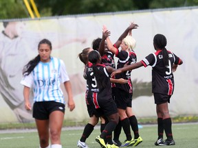 Ottawa Fury FC women celebrate a second half goal as a K-W United player walks away. Fury FC won the game 4-0 to clinch the Central Conference title and will head to Florida to compete for the W-League Championship. (Chris Hofley/Ottawa Sun)