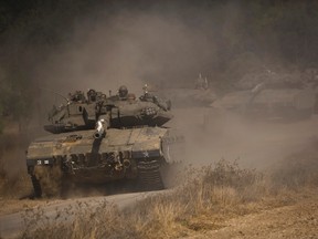 An Israeli convoy manoeuvres outside central Gaza Strip July 19, 2014. REUTERS/Amir Cohen