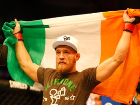 Conor McGregor celebrates following his win against Max Holloway in their featherweight bout at TD Garden on August 17, 2013 in Boston, Massachusetts. (Jared Wickerham/Getty Images/AFP)