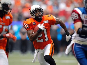 B.C Lions' Ryan Phillips (21) runs the ball against the Montreal Alouettes during the second half of their CFL football game in Vancouver, British Columbia, July 19, 2014. (REUTERS/Ben Nelms)