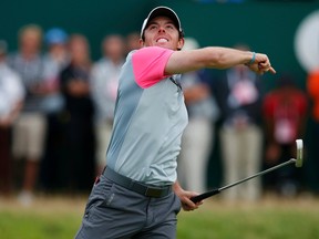 Rory McIlroy of Northern Ireland celebrates on the 18th green after winning the British Open Championship at the Royal Liverpool Golf Club in Hoylake, northern England July 20, 2014. (REUTERS)