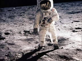 This July 20, 1969 file photo shows astronaut Edwin E. Aldrin Jr.  walking on the surface of the moon near the leg of the Lunar Module (ML) "Eagle". The 45 year anniversary of the landing will be marked on July 20, 2014.  AFP PHOTO / NASA/HANDOUT