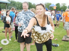 Victorious Secret team member Kelly Young of London was among more than 300 people who competed in the sixth annual Toss 'Em Up Against Childhood Cancer ring toss tournament at the Innerkip Community Centre on Saturday, July 19, 2014. Established in memory of Nick VanDyk - who died of cancer in 2008 when he was 19 - annual Toss 'Em Up tournaments in Seaforth, Ont., and Oxford County have raised almost $200,000 to fight childhood cancer over the past six years. Proceeds from the events support a local participant in the Sears National Coast-to-Coast Ride Against childhood Cancer. JOHN TAPLEY/INGERSOLL TIMES/QMI AGENCY