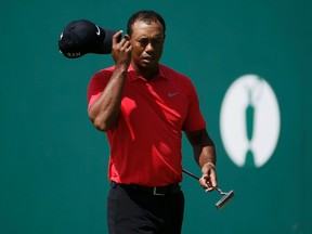 Tiger Woods of the U.S. tips his cap on the 18th green after finishing his final round of the British Open Championship at the Royal Liverpool Golf Club in Hoylake, northern England July 20, 2014. (REUTERS)