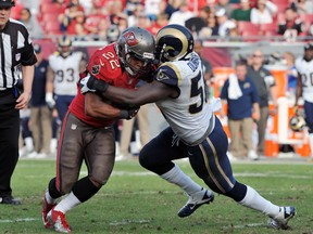 Linebacker Jo-Lonn Dunbar #58 of the St. Louis Rams tackles running back Doug Martin #22 of the Tampa Bay Buccaneers December 23, 2012 at Raymond James Stadium in Tampa, Florida. (Al Messerschmidt/Getty Images/AFP)