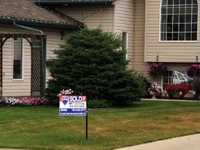 A sold sign stands in front of a residence on 63 Avenue on Friday, July 18. Grande Prairie recently had the best June on record for home sales, with homes being sold for an average price of $325,715, up 8% from the previous June.  Jocelyn Turner/Daily Herald-Tribune