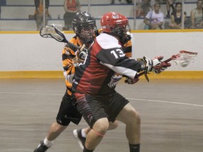 Sarnia Beavers defenceman Ryan Charteris (left) battles with Holden Vyse of the Six Nations Rivermen during their OLA Senior 'B' first round playoff game on Sunday, July 20. The Beavers were swept in the best of three series, losing Saturday night's game one by a score of 16-7 and Sunday's game 14-7. SHAUN BISSON/THE OBSERVER/QMI AGENCY