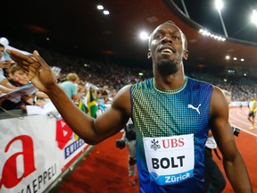 Usain Bolt of Jamaica celebrates after winning the men's 100 metres at the Weltklasse Diamond League athletics meeting in Zurich August 29, 2013. (REUTERS)