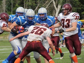 Dave Dale/QMI Agency
Cameron McDermid of the Sudbury Gladiators took half the Nipissing Wild football team with him for a run during his team's 24-7 win in North Bay on Saturday.