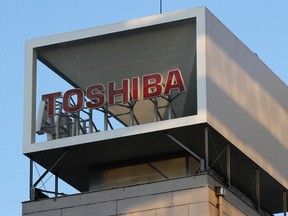 A logo of Toshiba Corp is seen atop of the company headquarters in Tokyo Jan. 31, 2013. REUTERS/Shohei Miyano