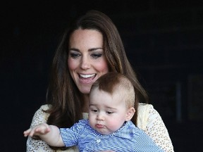 Catherine, Britain's Duchess of Cambridge, holds her son Prince George as they meet a Bilby which has been named after the young prince at Taronga Zoo in Sydney April 20, 2014. REUTERS/Chris Jackson