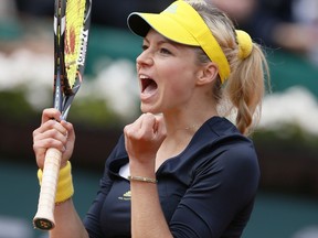 Russia's Maria Kirilenko celebrates after winning against USA's Bethanie Mattek-Sands during a French tennis Open round of 16 match at the Roland Garros stadium in Paris on June 3, 2013. (AFP PHOTO / PATRICK KOVARIK)