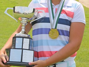 Courtney Tolton, of Mitchell, beams as she holds the Golf Association of Ontario’s Junior Girls’ Championship trophy last Friday, July 18 in Chatham.SUBMITTED PHOTO