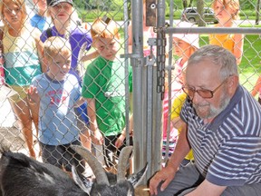 Bill French has been the volunteer caretaker of the animals at the West Perth animal farm, located in the Lions Park, for more than a decade. KRISTINE JEAN/MITCHELL ADVOCATE