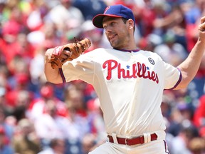 Philadelphia Phillies starting pitcher Cliff Lee (33) pitches in the first inning against the Cincinnati Reds at Citizens Bank Park. Mandatory Credit: Bill Streicher-USA TODAY Sports